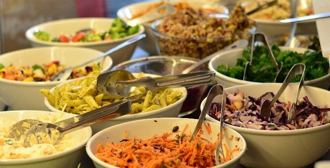 a table full of bowls of food description automat